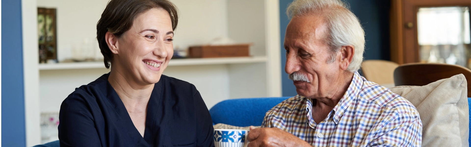 Caregiver talking to elderly