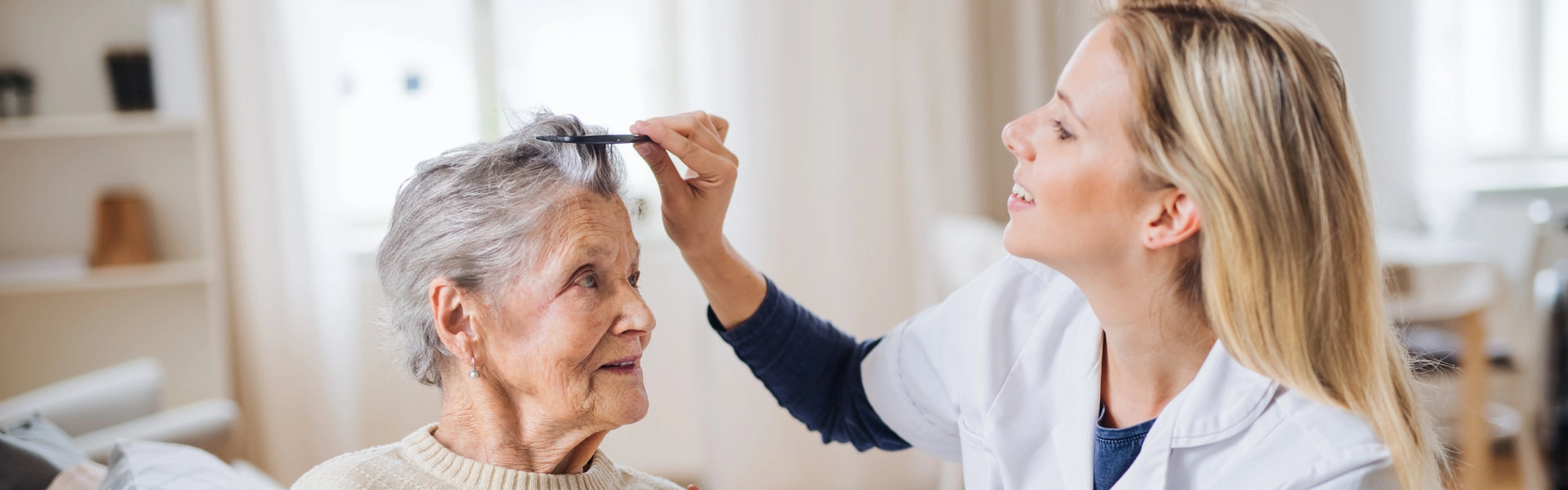Caregiver combing hair